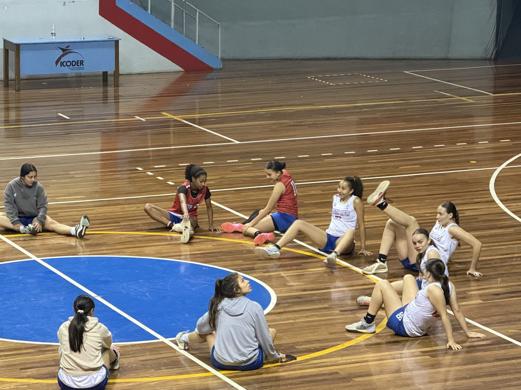 Naima stretching with a national team training group
